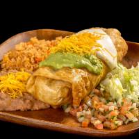 #13. Chimichanga Plate · Shredded beef or chicken burrito, deep fried, topped with guacamole, sour cream, cheese, pic...