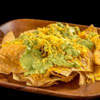Chips With Guacamole · Corn tortilla chips, guacamole, and cheese.
