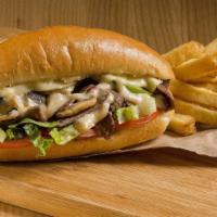 The Philly Cheesesteak With Fries · Sizzling fresh top sirloin steak with onions, mushrooms, green peppers, choice of cheese and...