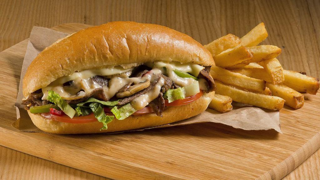 The Chicken Cheesesteak With Fries · Grilled chicken with onions, mushrooms, green peppers, choice of cheese and stuffed in a fresh-baked roll.