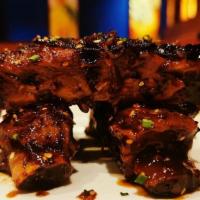 Szechuan Spiced Pork Ribs · Roy's Signature items. Smoked and glazed in Roy's original Mongolian sauce.