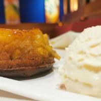 Pineapple Upside Down Cake · Caramelized pineapple baked with brown sugar pound cake à la mode.