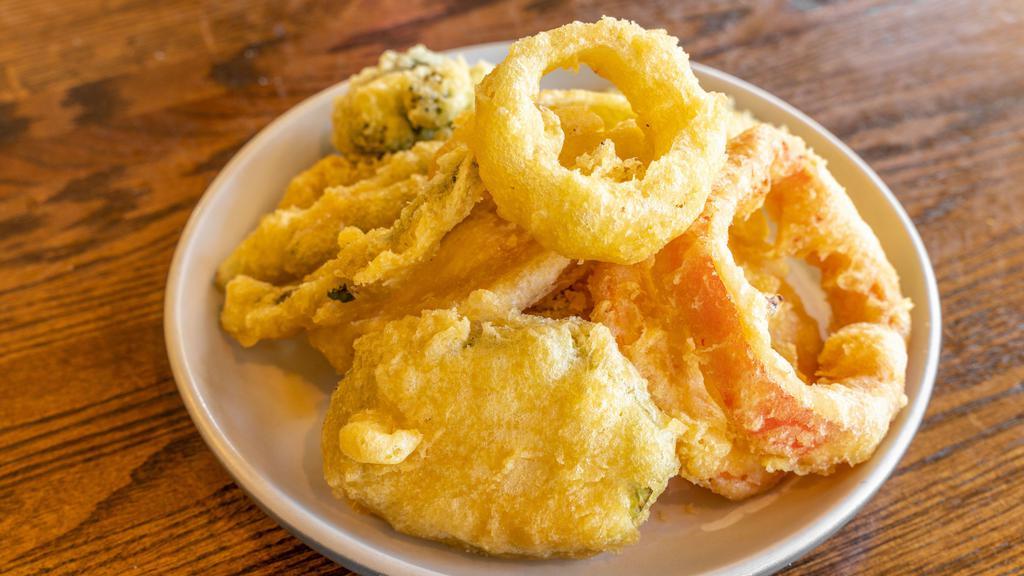 Tempura Vegetables · Broccoli, onion, bell pepper, yam and zucchini dipped in tempura and lightly fried.