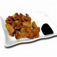 Fried Chicken (Karaage) · Lightly fried chicken breast marinated in ginger, garlic & soy sauce.