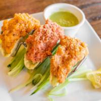 Spicy Tacos · spicy tuna, spicy salmon, spicy yellowtail in deep-fried gyoza skin, served with avocado, to...