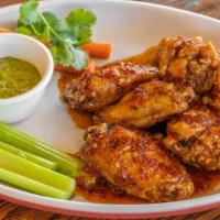 Sg Spicy House Wings · 6 Pieces of deep fried wings tossed in a house made spicy sauce and served with a cilantro s...
