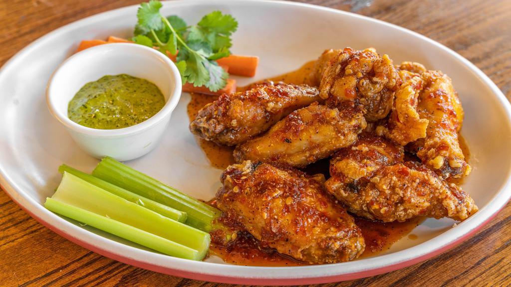 Sg Spicy House Wings · 6 Pieces of deep fried wings tossed in a house made spicy sauce and served with a cilantro sauce.