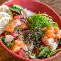 Rainbow Poke Bowl · Salmon, Tuna, & Yellowtail with a layer of spring mix, seaweed salad, avocado, cucumber, rad...