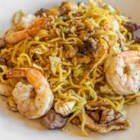 Yakisoba Combination · Stir fried wheat noodles with vegetables and chicken breast, NY Steak, and shrimp in a homem...