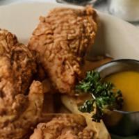 Chicken Fingers · Four pieces of chicken tenderloin battered, fried and served with honey mustard dressing wit...