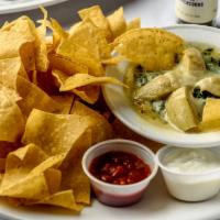 Spinach Dip · Spinach and marinated artichoke hearts with Monterey Jack,  Romano, and Parmesan cheese.