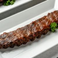 Fulton Street Ribs · Petite 1 Pound Pork Rib. Marinated for 24 hours, slow cooked in our special oven, then finis...