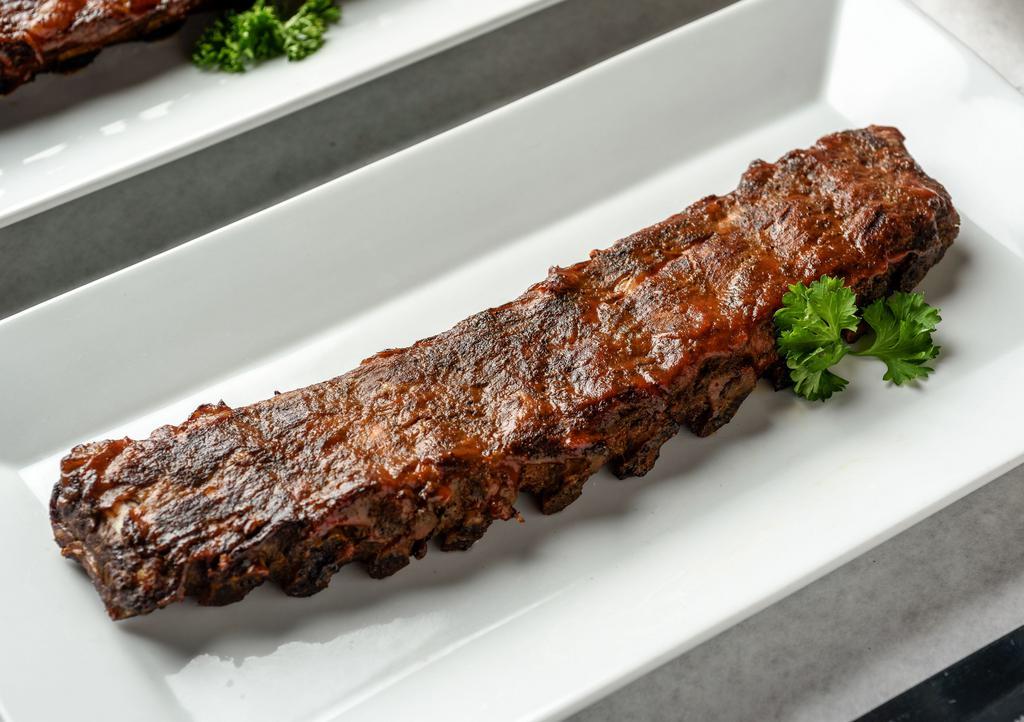 Fulton Street Ribs · Petite 1 Pound Pork Rib. Marinated for 24 hours, slow cooked in our special oven, then finished on the grill, and lightly glazed with BBQ sauce.