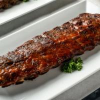 Full Rack Ribs · 1.5 Pound Full Rack Marinated for 24 hours, slow cooked in our special oven, then finished o...