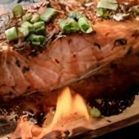 Cedar Plank Salmon · Fresh 8 oz. filet of salmon broiled on a smoldering cedar plank with Jamaican brown sugar gl...