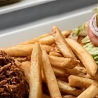 Pulled Pork Sandwich · Our award winning recipe for tender, smoked pulled pork. Served on a bun.