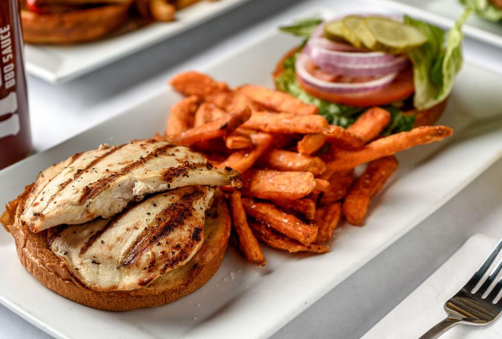 Charbroiled Chicken Sandwich · Marinated chicken breast served on a brioche bun with Swiss cheese, avocado, and tomato.