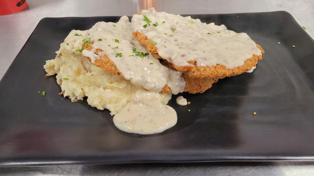 Chicken Fried Steak · 8 oz. of tender beef fried traditionally and served with country gravy and garlic mashed potatoes.