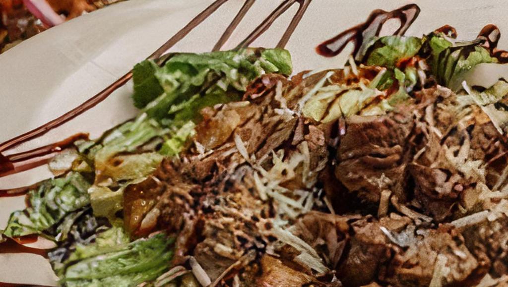 Chop House Ceasar · 7 oz. sliced top sirloin served over our homemade Caesar salad, with grilled onions and crisped bacon bits, then drizzled with a balsamic reduction.
