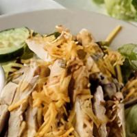 Grilled Chicken Salad · Mixed greens topped with guest's choice of chicken and dressed with tomato, cheese, red onio...