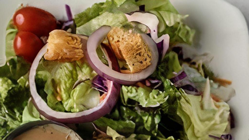House Salad · Mixed greens and romaine lettuce topped with sliced carrots, red cabbage, cucumbers, tomatoes, red onions, and croutons.