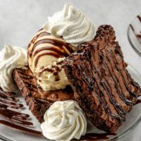 Ice-Cream Brownie Sandwich · We sandwich vanilla ice cream between two warm rich chocolate brownies and drizzle chocolate...