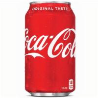 Canned Coke · A can of Coke, served cold.