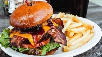 Bbq Western Bacon Burger · Cheddar cheese, bacon, lettuce, tomato & mayonnaise. Topped with our bold BBQ sauce & onion ...