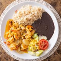 Camarones Al Mojo · Sautéed prawns with mushrooms, onions and garlic sauce. Served with rice, beans and salad an...