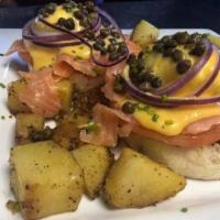 Lox Bennie · Toasted English muffin, poached eggs, smoked salmon, sliced tomato, red onion, capers, and c...