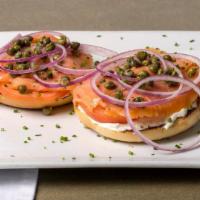 Lox Bagel · Smoked salmon, sliced tomato, sliced red onion, cream cheese, capers, and chives on a toaste...