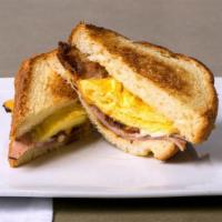 Breakfast Super Sammy · Fried hard egg with ham, bacon, provolone & cheddar cheese on toasted 1” focaccia bread.
