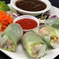Fresh Summer Rolls · Two rice paper rolls with chicken, shrimp, rice noodles, mint, cucumber & cabbage. Served wi...