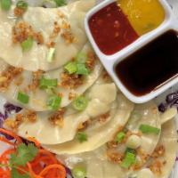 Tofu Spinach Potstickers · Six steamed potstickers filled with tofu & fresh spinach topped with crispy garlic & scallio...