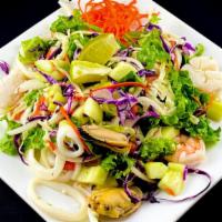 Seafood Salad · Steamed scallops, shrimp and mussels tossed with green leaf lettuce, cilantro, tomato, onion...