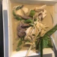 Green Basil Curry  · A spicy green curry with hints of basil & Thai chilis served with coconut cream, green beans...