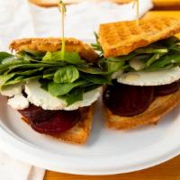 Beet Napoleon · Roasted beets, chevre cheese, fresh spinach splashed with champagne vinaigrette and maple bu...