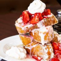 Strawberries & Cream French Toast · Three pieces of French Toast. Layered with sweet cream. Topped with caramelized strawberries...