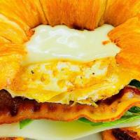 Breakfast Croissant · Over hard egg topped with melted jack cheese, fresh spinach, crispy bacon, tomato & mayo on ...