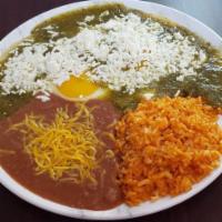 Huevos Rancheros · 2 fried corn tortillas with 2 eggs, covered in red or green salsa with a side
of refried bea...