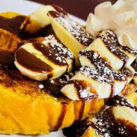 Bannana & Nutella French Toast · Three pieces of French Toast. Topped with fresh sliced bananas, rich Nutella drizzle, whippe...