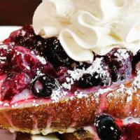 Mixed Berries French Toast · Three pieces of French Toast. Layered with sweet cream. Topped with triple  Berries Medley, ...