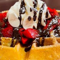 Strawberry Nutella Waffle · Belgian Waffle, Topped with strawberries, rich Nutella drizzle, whipped cream and powdered s...