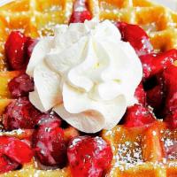 Strawberries Waffles · Belgian Waffle. Topped with Strawberries, condensed milk, whipped cream and powdered sugar.