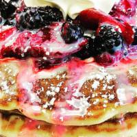 Mixed Berries Pancakes · 3 fluffy Buttermilk Pancakes. Layered with sweet cream. Topped with delicious berry medley, ...