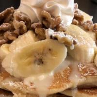 Banana Walnut Pancakes · 3 fluffy Buttermilk Pancakes. Layered with delicious sweet cream. Topped with fresh sliced b...