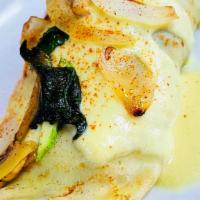 Veggie Crepe · Sautéed zucchini, squash, bell peppers, mushrooms, onions, spinach, wrapped in warm crepe ba...