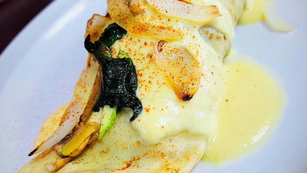 Veggie Crepe · Sautéed zucchini, squash, bell peppers, mushrooms, onions, spinach, wrapped in warm crepe bathed in hollandaise sauce. side of O'Brien hash brown
