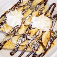 Banana & Nutella Crepes · Two fresh-warm crepes, smothered with Nutella spread, topped with fresh banana slices, whipp...
