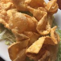Crab Puffs · Eight creamy filled imitation crab and cream cheese wontons.
